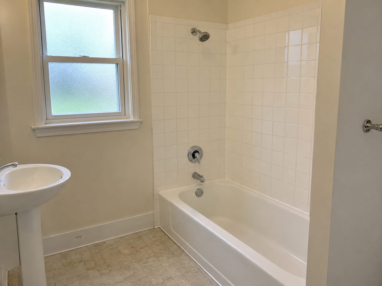 Freshly remediated ceramic tile shower enclosure in a New Jersey colonial home bathroom with pristine grout lines and dry treated surfaces