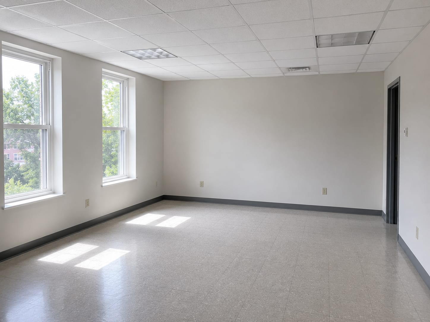 Clean restored commercial office interior with fresh drywall paint and new ceiling tiles after completed mold remediation in a central New Jersey building