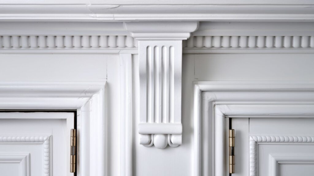 Immaculate white door frame showing spotless surfaces, clean hardware and dust-free molding details.